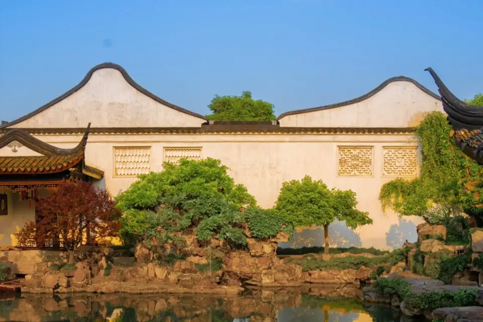 Classical Suzhou garden reflected in a pond